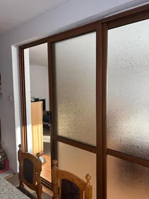 a sliding glass door with a view of a room at Kiryanov's apartment in Sandanski