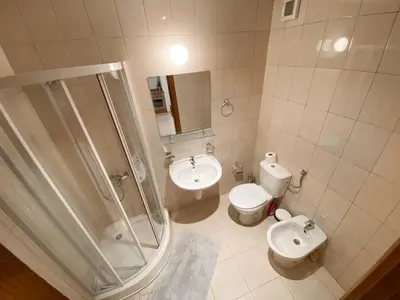 a bathroom with a shower and a toilet and a sink at Private Studio 500m from Gondola in Bansko