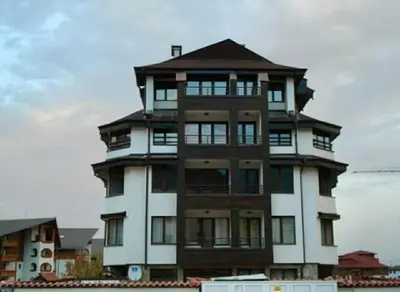 a large tall building with a roof at ElGora Studio в Apart Hotel Comfort in Bansko