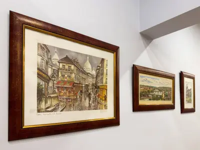 a group of three framed pictures hanging on a wall at Central 2BR Near Vitosha - Calm, Spacious Stay in Sofia