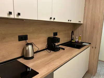 a kitchen with a counter top with a coffee maker at Flat in Darvenitsa near Church St George the Victorious in Sofia