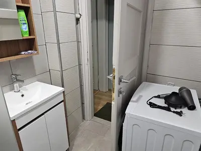 a small bathroom with a sink and a toilet at 4BR Central Retreat in Sofia