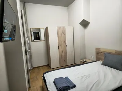 a bedroom with a bed and a tv in it at 4BR Central Retreat in Sofia