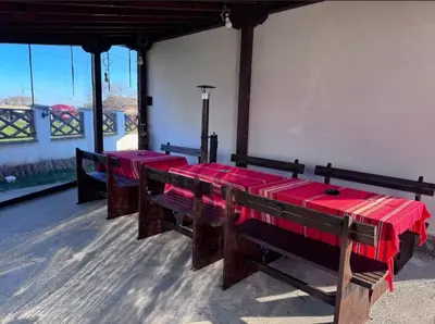 a row of red benches in a room with windows at RhodoNest in Kara Agach