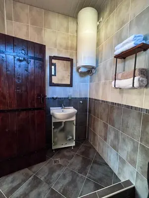 a bathroom with a sink and a mirror at RhodoNest in Kara Agach