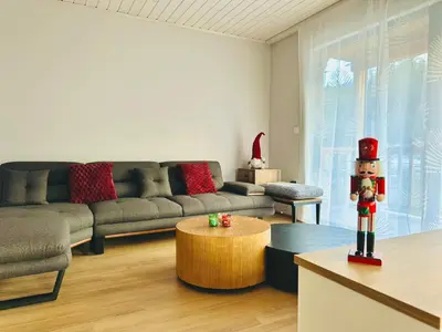 a living room with a couch and a table at Борово ухание Говедарци Pine scent Govedartsi in Govedartsi
