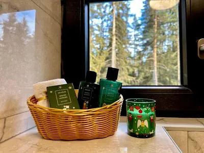 a basket of soap and books on a counter next to a window at Борово ухание Говедарци Pine scent Govedartsi in Govedartsi