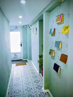 a hallway with a wall with books and lamps at GuestHouse3 Karma369 in Plovdiv