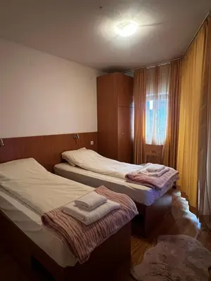 a bedroom with two beds and a window at Lucky Star Bansko Next to the Ski Lift with FREE Parking in Bansko