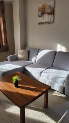 a living room with a couch and a coffee table at Apartments Pamporovo, Green life apartment hotel in Pamporovo