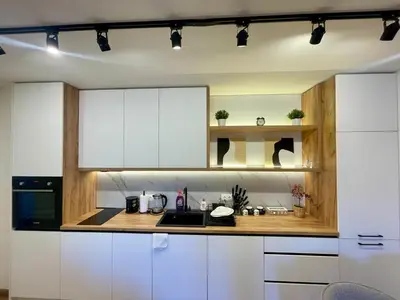 a kitchen with white cabinets and a counter top at Casa Brisa by Vistay Residences Apartment Sofia - with Free Secured Parking in Sofia