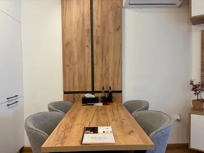 a conference room with a wooden table and chairs at Casa Brisa by Vistay Residences Apartment Sofia - with Free Secured Parking in Sofia