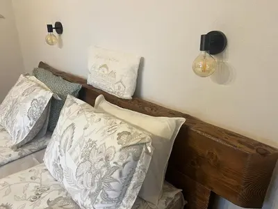 a bedroom with a bed with pillows on it at Rilski Chardak in Sapareva Banya