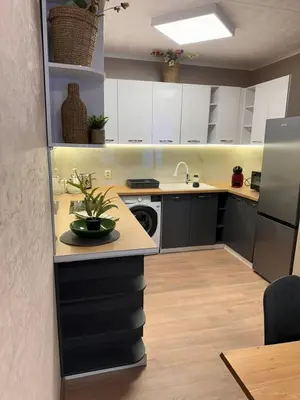 a kitchen with white cabinets and a dishwasher at Apart-Hotel Crow Bansko 3 in Bansko