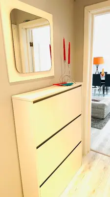 a dresser with a mirror on top of it at Bulgaria Mall Flat in Sofia