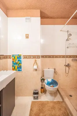 a bathroom with a toilet and a shower and a sink at Free parking 1BR Tokuda Lozenets in Sofia
