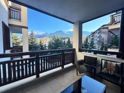 a balcony with a view of a mountain at Alpine Glow - Panoramic View near Gondola in Bansko