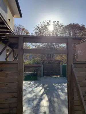 a wooden gate to a driveway with a fence at Пътепис in Bratsigovo