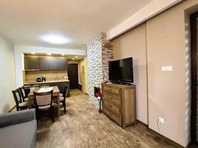 a living room with a kitchen and a dining room at Cozy 1BR Mountain View Suite for 4 Guests in Bansko
