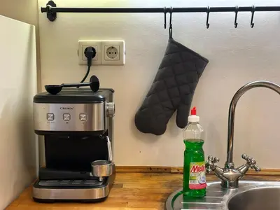 a kitchen counter with a coffee maker and a sink at Romantic 1BDR apt near Eagle bridge - Fast Wi-Fi in Sofia