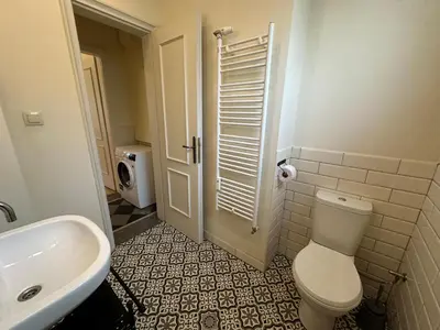 a bathroom with a white toilet and a sink at Romantic 1BDR apt near Eagle bridge - Fast Wi-Fi in Sofia