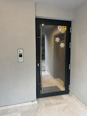 a door with a mirror on the side of a building at MedHill Stay - Medical University Area in Plovdiv