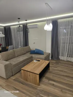 a living room with a couch and a coffee table at Diljanka 4 in Pernik