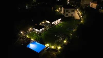 an overhead view of a house at night with lights at Къща за гости Мартинели