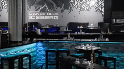 a dance club with tables and chairs in a bar at Iceberg Studio 15 in Borovets