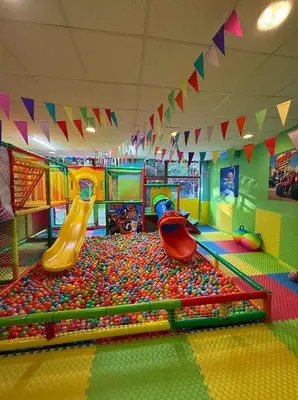a childrens play room with a slide and a playground at Iceberg Studio 15 in Borovets
