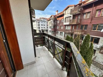 a balcony with a view of some buildings at Belmont urban one bedroom apartment in Bansko