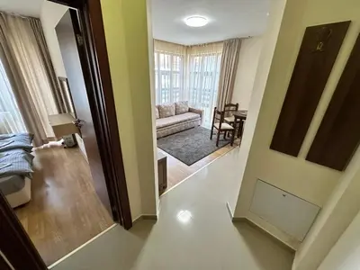 a view of a living room from the hallway at Belmont urban one bedroom apartment in Bansko