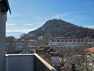 a view of a mountain from a city at Plovdiv Hills Apartments with FREE Parking in Plovdiv