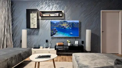 a living room with a bed and a table at Spacious 3 BDR City Pulse near Airport, The Mall, Arena 8888 by KeyBox in Sofia