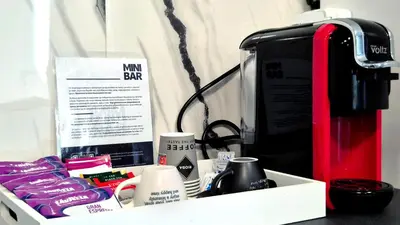 a tray with a coffee maker and other items at Spacious 3 BDR City Pulse near Airport, The Mall, Arena 8888 by KeyBox in Sofia