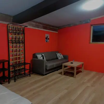 a living room with a couch and a table at MOTEL Route 80 in Bozhurishte