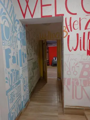 a hallway with graffiti on the walls of a building at MOTEL Route 80 in Bozhurishte