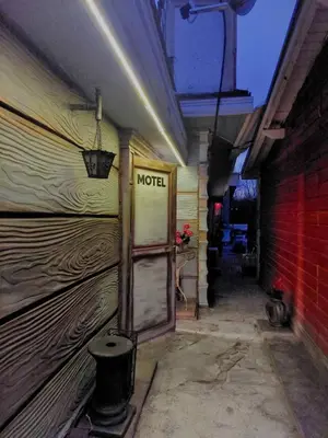 a room with a motel sign on the side of a building at MOTEL Route 80 in Bozhurishte
