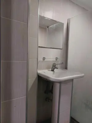 a bathroom with a sink and a mirror at MOTEL Route 80 in Bozhurishte