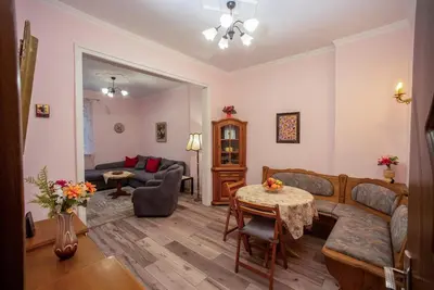 a living room with a couch and a table at Alex's Charming Apartment by NDK in Sofia