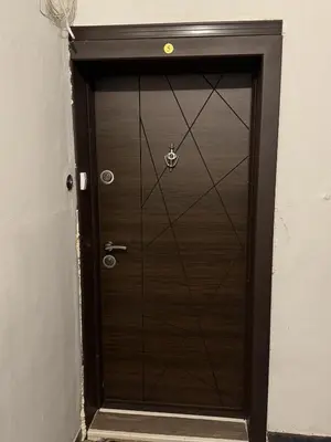 a brown door with a handle in a room at Alex's Charming Apartment by NDK in Sofia
