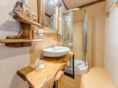 a bathroom with a sink and a shower at Raikovski Livadi Mountain Villas Pamporovo in Smolyan