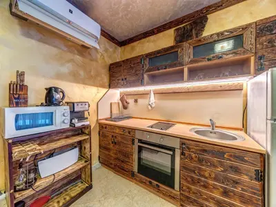 a kitchen with a sink and a microwave at Raikovski Livadi Mountain Villas Pamporovo in Smolyan