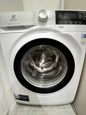 a white washing machine with its door open at Barcelona 2BDR Cozy Apt w Working Space near Metro in Sofia
