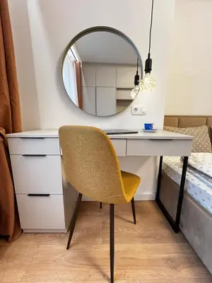 a mirror above a desk with a yellow chair at Barcelona 2BDR Cozy Apt w Working Space near Metro in Sofia