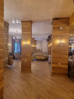 a large living room with a couch and a table at WoodLux in Pamporovo