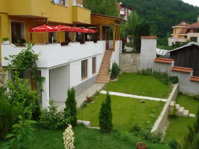 a house with a yard with a lawn sidx sidx sidx at Royal Apartment in Smolyan