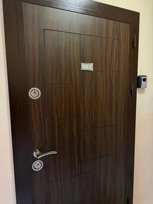 a wooden door with the number on it at Belmont Apartment in Bansko
