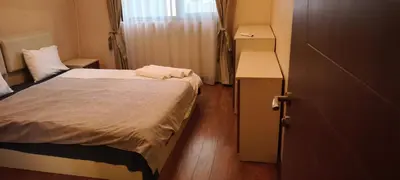 a small bedroom with a bed and a cabinet at One Bedroom Apartment 4 - Restaurant Stadium Plovdiv in Plovdiv