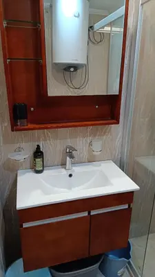 a bathroom with a white sink and a mirror at One Bedroom Apartment 4 - Restaurant Stadium Plovdiv in Plovdiv